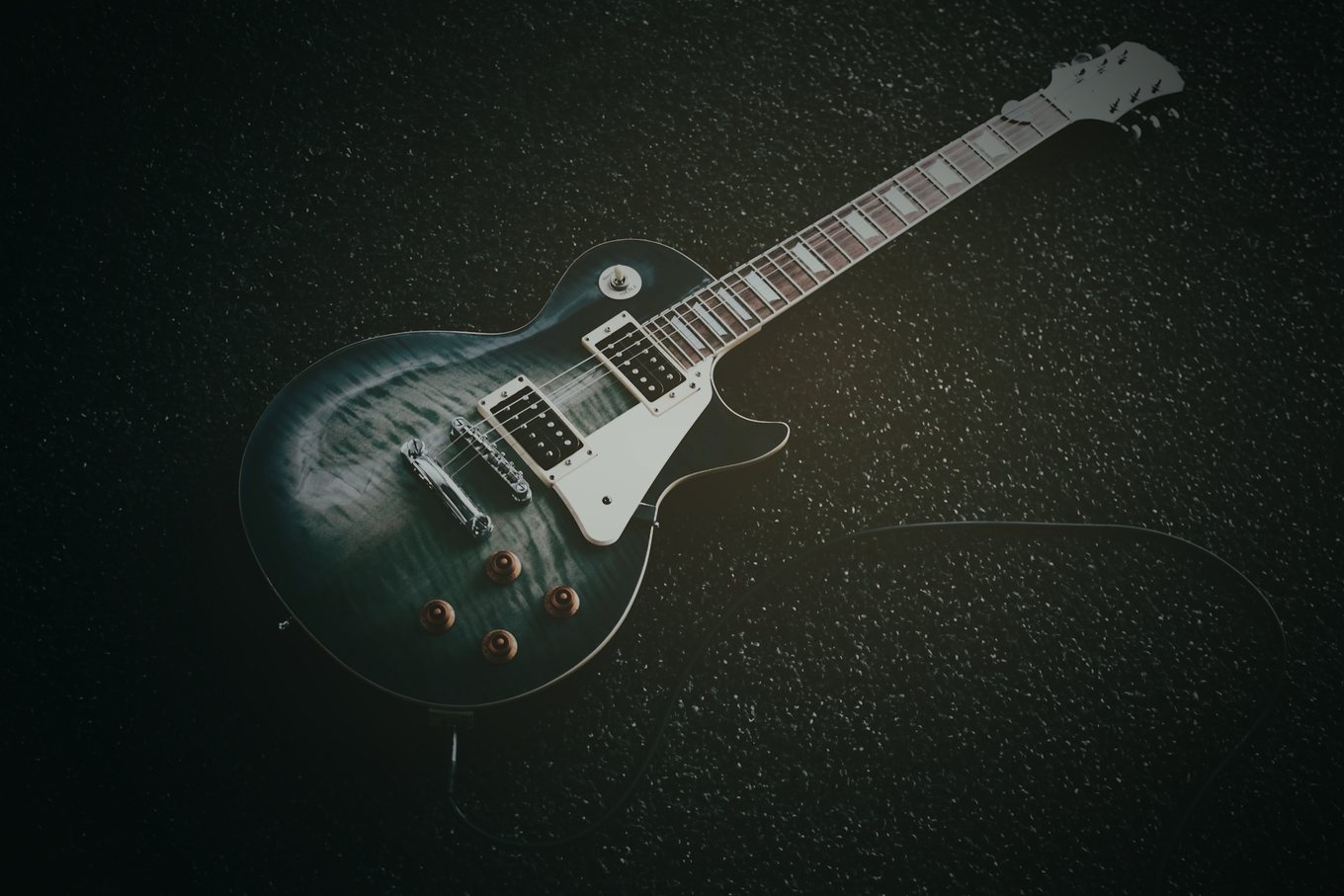 Electric guitar in a dark studio